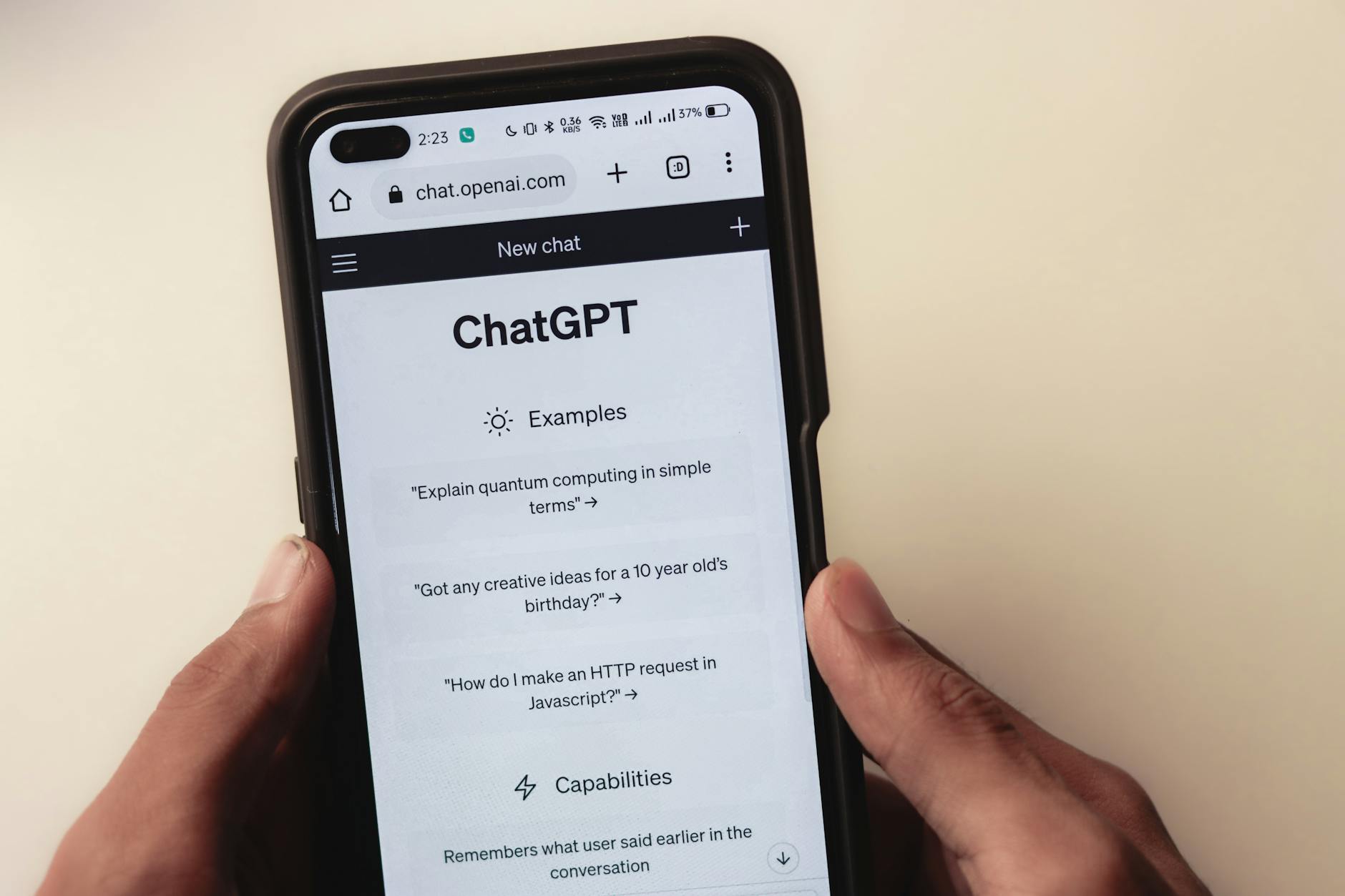 webpage of chatgpt a prototype ai chatbot is seen on the <a href='https://earninghi.com/graphing-calculator' target='_blank' rel='follow'>website</a> of openai on a smartphone examples capabilities and limitations are shown” class=”wp-image-8425″/><figcaption class=